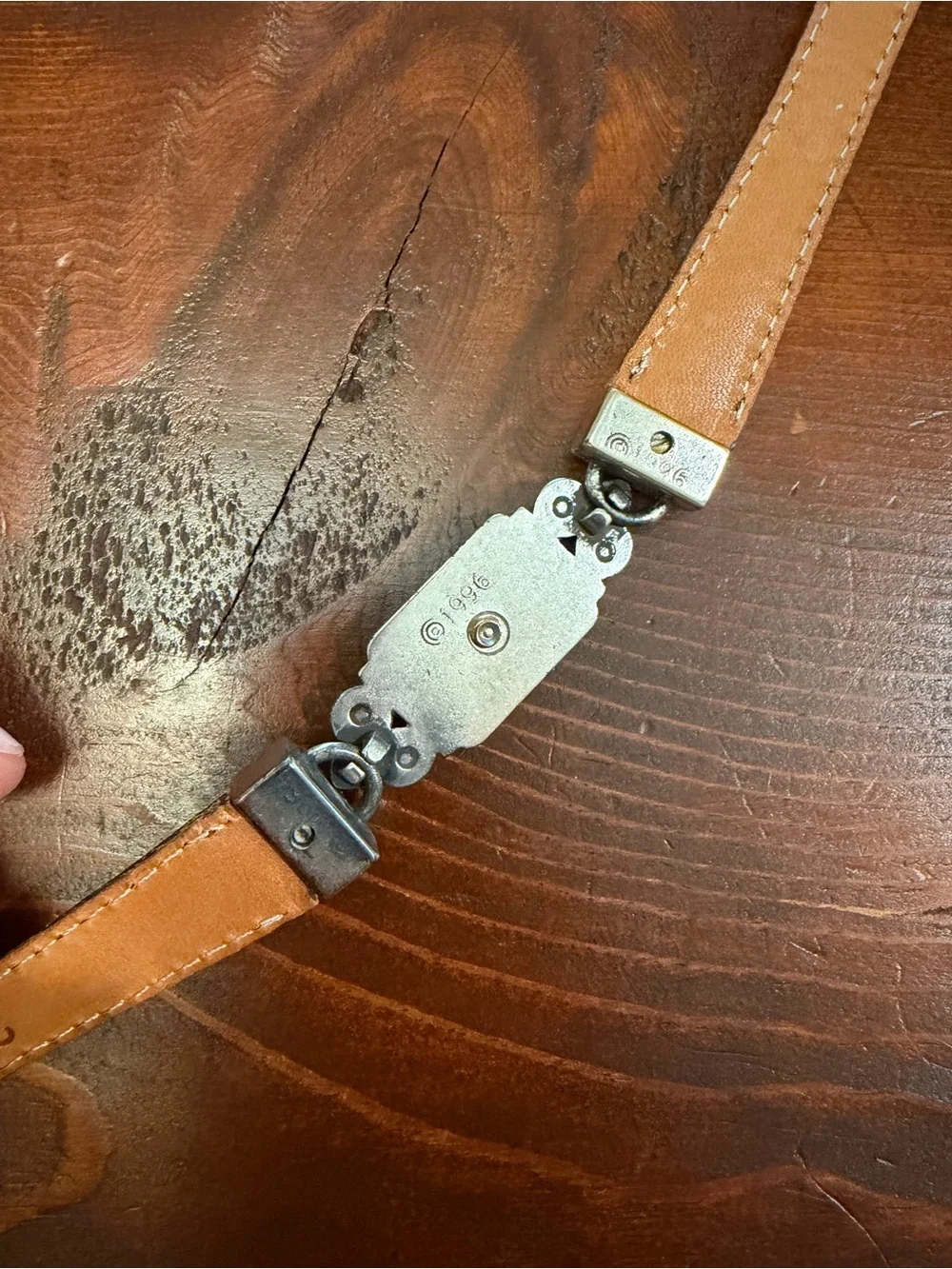1996 Branded metal and leather accent belt